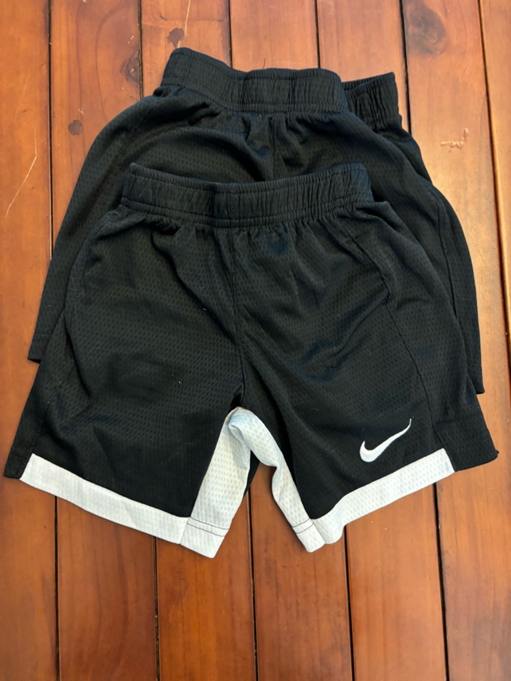 Nike Black Mesh Athletic Shorts with White Swoosh